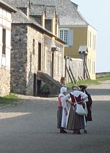 Photo of reenactors conversing in Fortress Louisburg