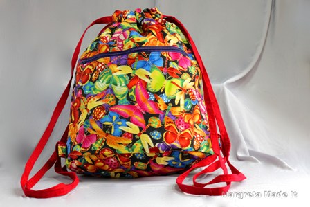 The Bigger on the Inside Bag with bugs and butterflies fabric. Front zipped pocket and inside slip pocket.
