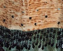 Detail of beadwork and pleating